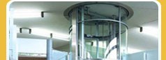 Glass passenger lift installed in a finished building.