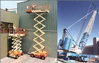 Scissor lifts and a mobile crane in the yard.